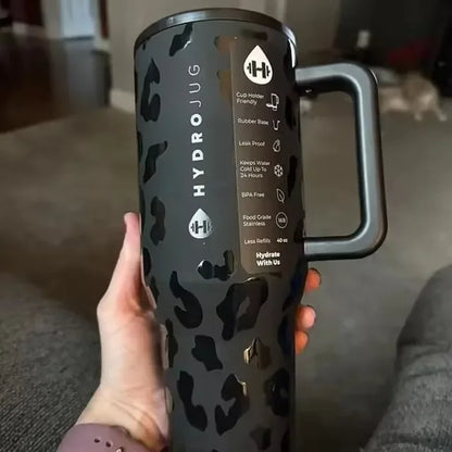 Close-up of black leopard print HydroJug Gobelet 40OZ Voyageur Thermos with product features listed on the side label.