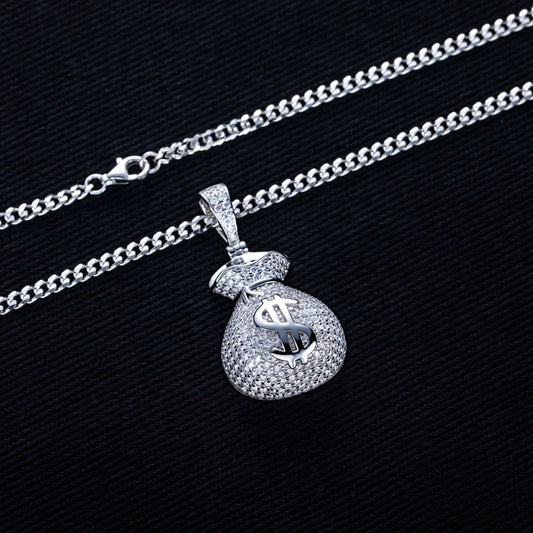 Silver necklace with a dollar bag pendant on a black background