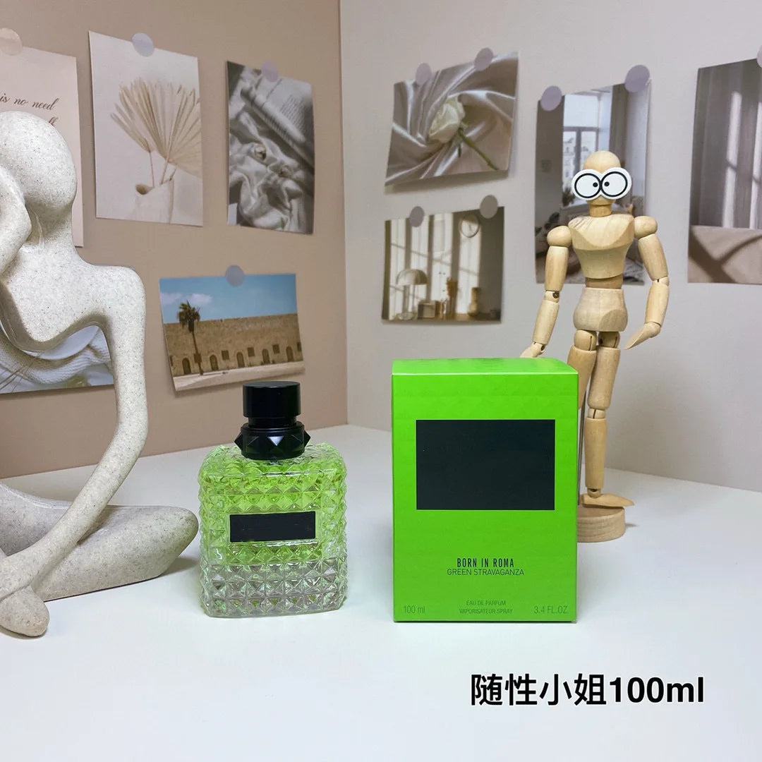 Valentino Green perfume bottle and box on a table with decorative items in the background