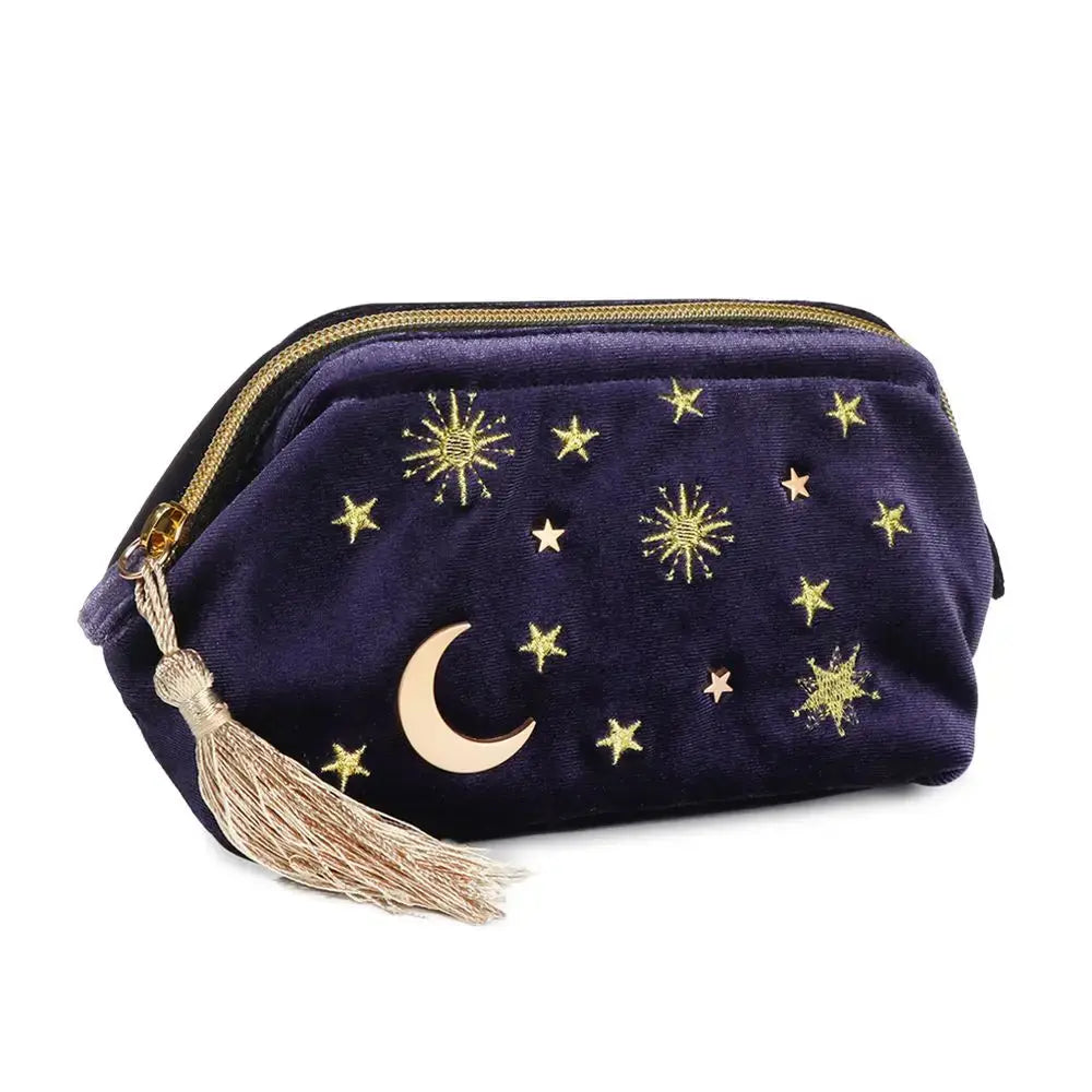 Purple pouch with gold stars and a moon design on a white background
