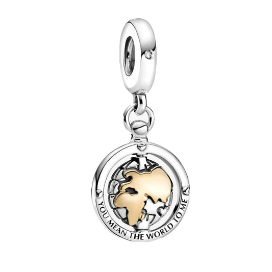 Silver and gold charm with 'You Mean the World to Me' text on a white background