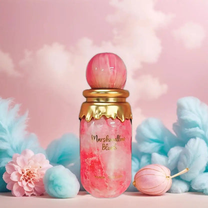 Pink and gold bottle with 'Marshmallow' text on a soft pink background with cotton candy and flowers.
