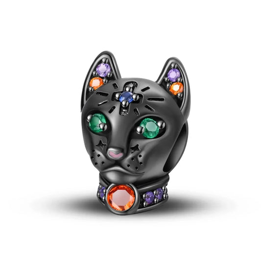 Black cat-shaped figurine with colorful gemstones on a white background