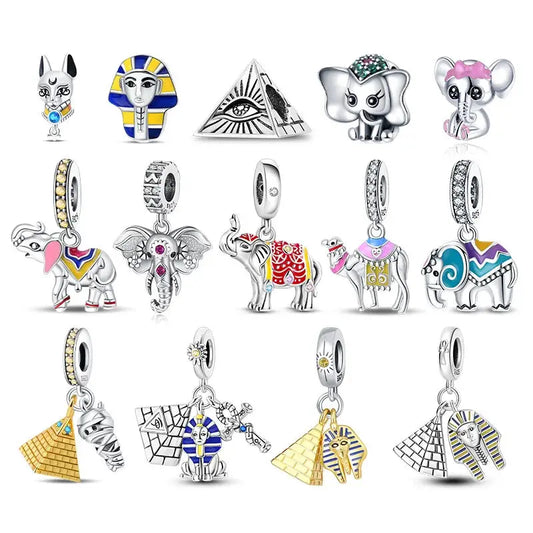 Collection of various animal-themed charms on a white background