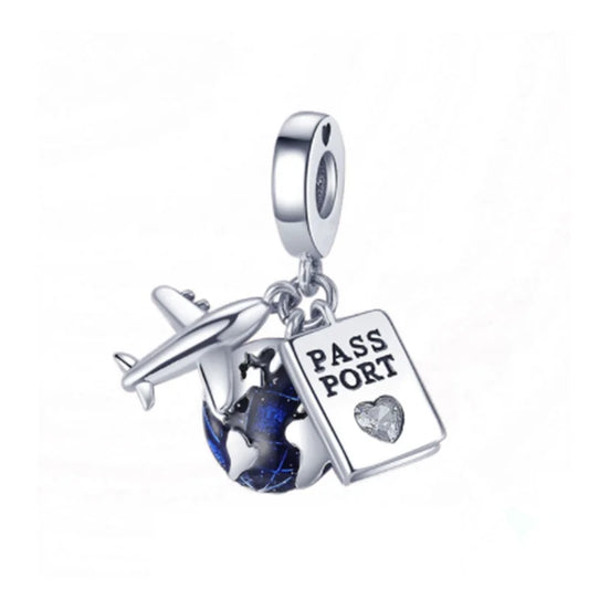 Silver charm with airplane, heart, and passport book on a white background