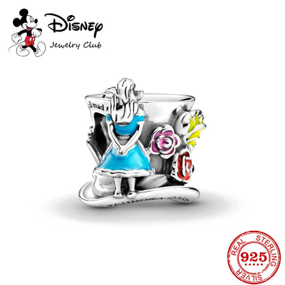 Disney jewelry charm featuring a character in a blue dress with flowers on a white background.