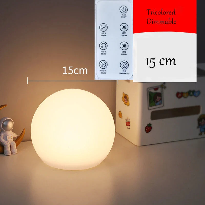 Round night light with control panel and measurement label on a surface
