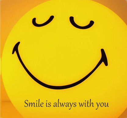 Smiley face with 'Smile is always with you' text on a yellow and orange gradient background