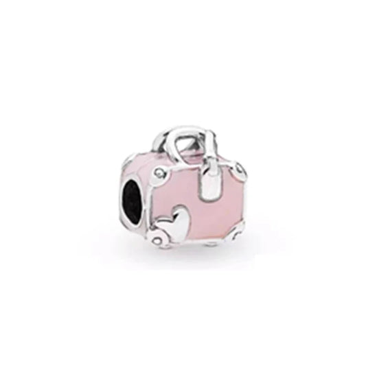 Silver charm with pink enamel on a white background