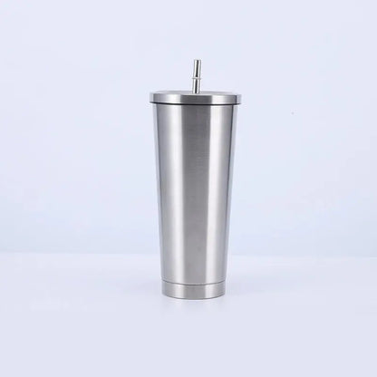 Stainless steel tumbler with a straw on a white background
