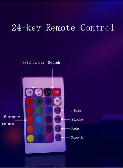 24-key remote control with color display and labeled buttons on a dark background