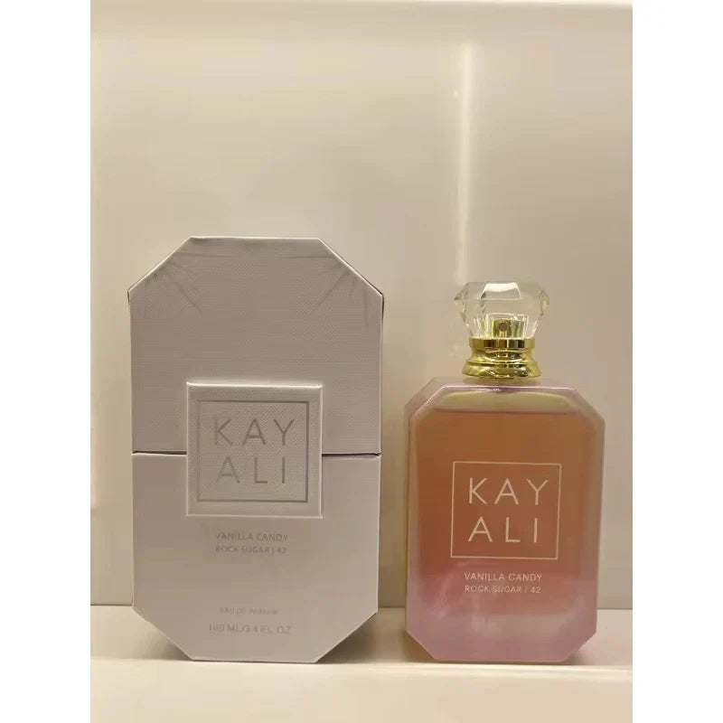 Two perfume bottles by KAY ALI on a neutral background